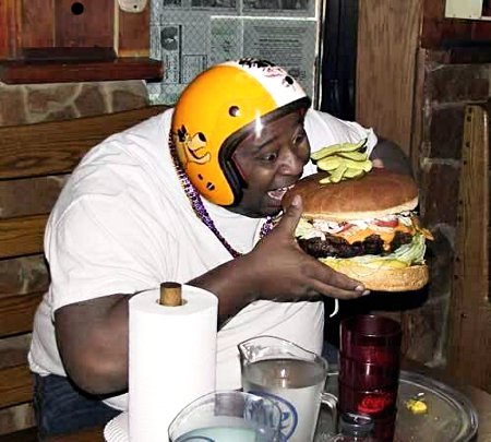 Fat Black Fool Gorging On A Giant Burger